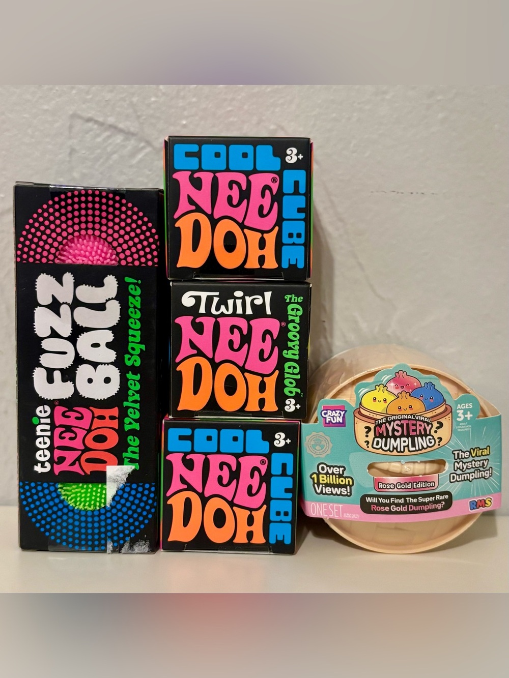 NeeDoh Fidget Toys - Teenie Fuzz Balls, Twirl, Cube, & RMS Mystery Mini Dumpling